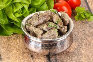 Chicken liver with cream sauce photo