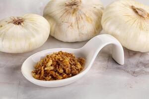 Dried roasted onion flakes for culinary photo