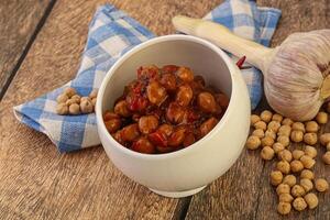 Baked chickpea with tomato sauce photo