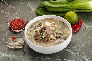 Vietnamese soup Pho Bo with beef photo