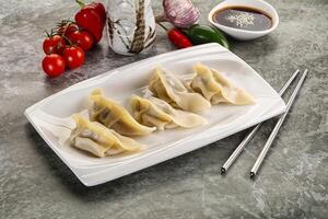 Japanese cuisine - dumplings gyoza with sauce photo