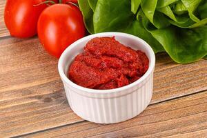 Tomato puree sauce for cooking photo