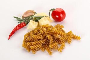 Raw whole grain pasta fusilli photo