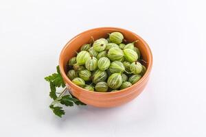 Sweet ripe gooseberries in the bowl photo