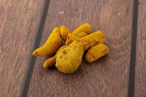 Indian spices - Turmeric root Curcuma photo