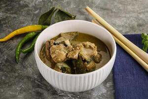 Thai green curry soup with basil photo