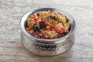 Arabic cous cous with meat and tomato photo