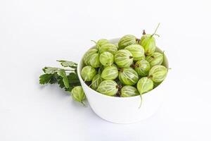 Sweet ripe gooseberries in the bowl photo