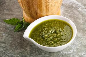 Homemade vegetarian basil pesto sauce photo