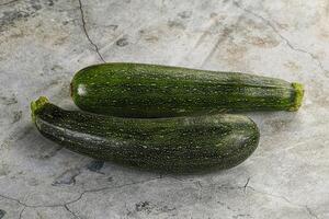 Raw young small green zucchini photo