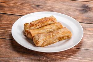 Traditional crispy fried stuffed springroll photo