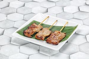 Thai cuisine - grilled pork skewer photo