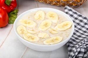 Sweet porridge with banana breakfast photo