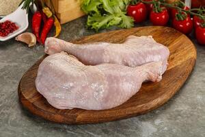 Raw chicken leg foe cooking photo