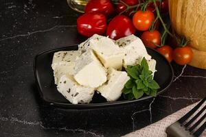 Greek traditional Feta cheese cubes photo