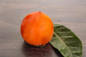 Fresh ripe sweet juicy persimmon photo