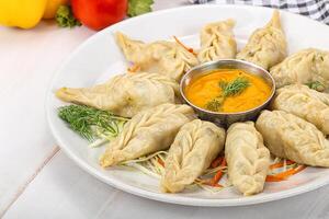 Steamed asian dumpling momo with meat photo