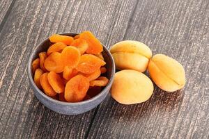 Dried apricot heap in the bowl photo