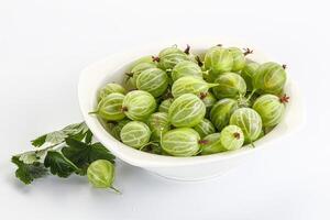 Sweet ripe gooseberries in the bowl photo