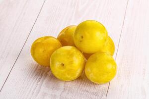 Yellow sweet plum heap fruit photo