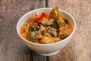 Thai red spicy curry with chicken photo