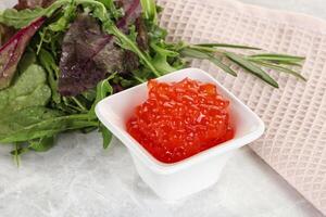 Red caviar in the bowl photo