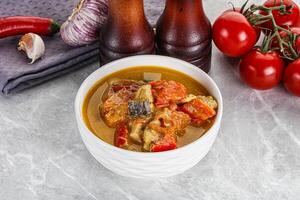 Traditional yellow Thai curry with chicken photo