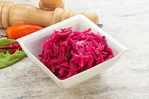 Marinated cabbage with beetroot and spices photo