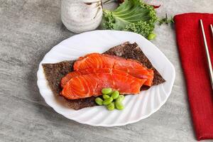 Sliced salmon sashimi in the plate photo