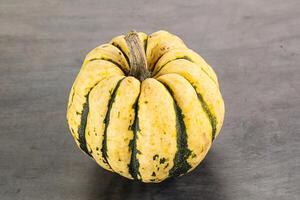 Ripe raw fresh decorative pumpkin photo