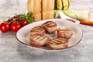 Grilled pork tenderloin with bacon photo