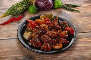 Asian cuisine - pork with chili sauce photo