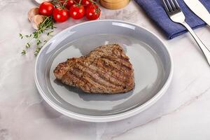 Grilled marble beef steak with sauce photo