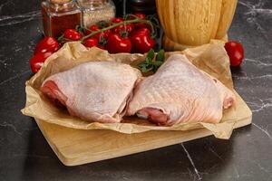 Raw chicken thigh for cooking photo