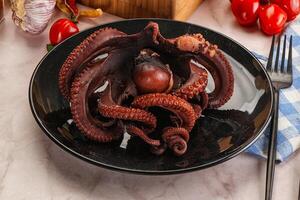 Boiled delicous Octopus in the bowl photo