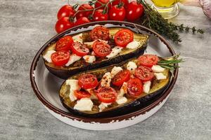 Baked eggplant with cheese and tomato photo