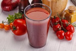 Fresh Tomato juice in the glass photo