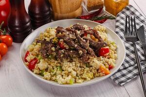 Traditional couscous with beef and vegetables photo