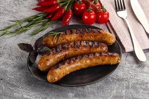 Grilled meat sausages with spices photo