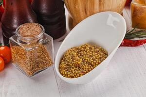 Spicy mustard sauce with seeds photo