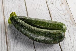 Raw young small green zucchini photo