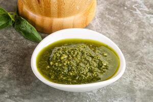 Homemade vegetarian basil pesto sauce photo