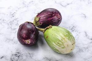 Heap of raw asian baby eggplant photo