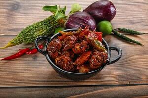 Asian cuisine - pork with chili sauce photo