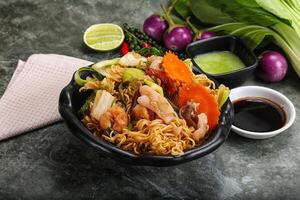 Asian cuisine - Fried noodles with seafood photo