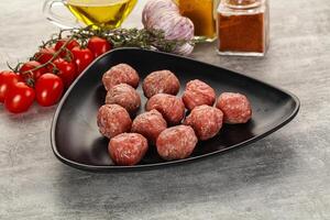 Uncooked raw beef meatball minced photo