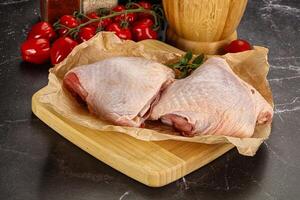Raw chicken thigh for cooking photo