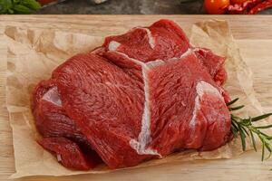 Raw beef meat piece for cooking photo