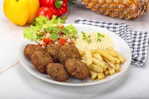 Falafel with hummus and fried potato photo