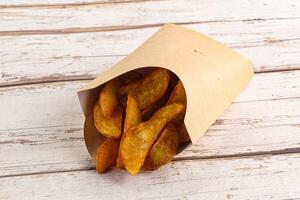 Fried rustic golden potato heap photo